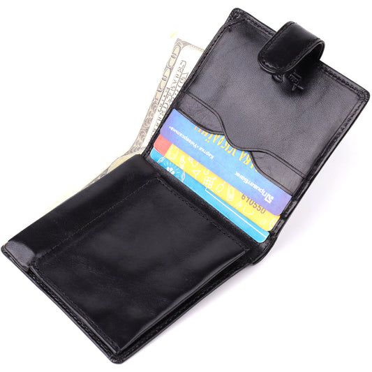 Tony Perotti Italico 1256 nero black leather wallet open and filled — dollar banknotes and cards in the slots, embossed Tony Perotti signature