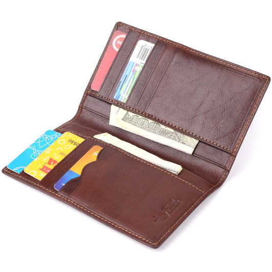 Tony Perotti Italico 1438 moro dark brown leather wallet open and filled — loyalty and bank cards in the slots, a dollar banknote tucked behind the flap