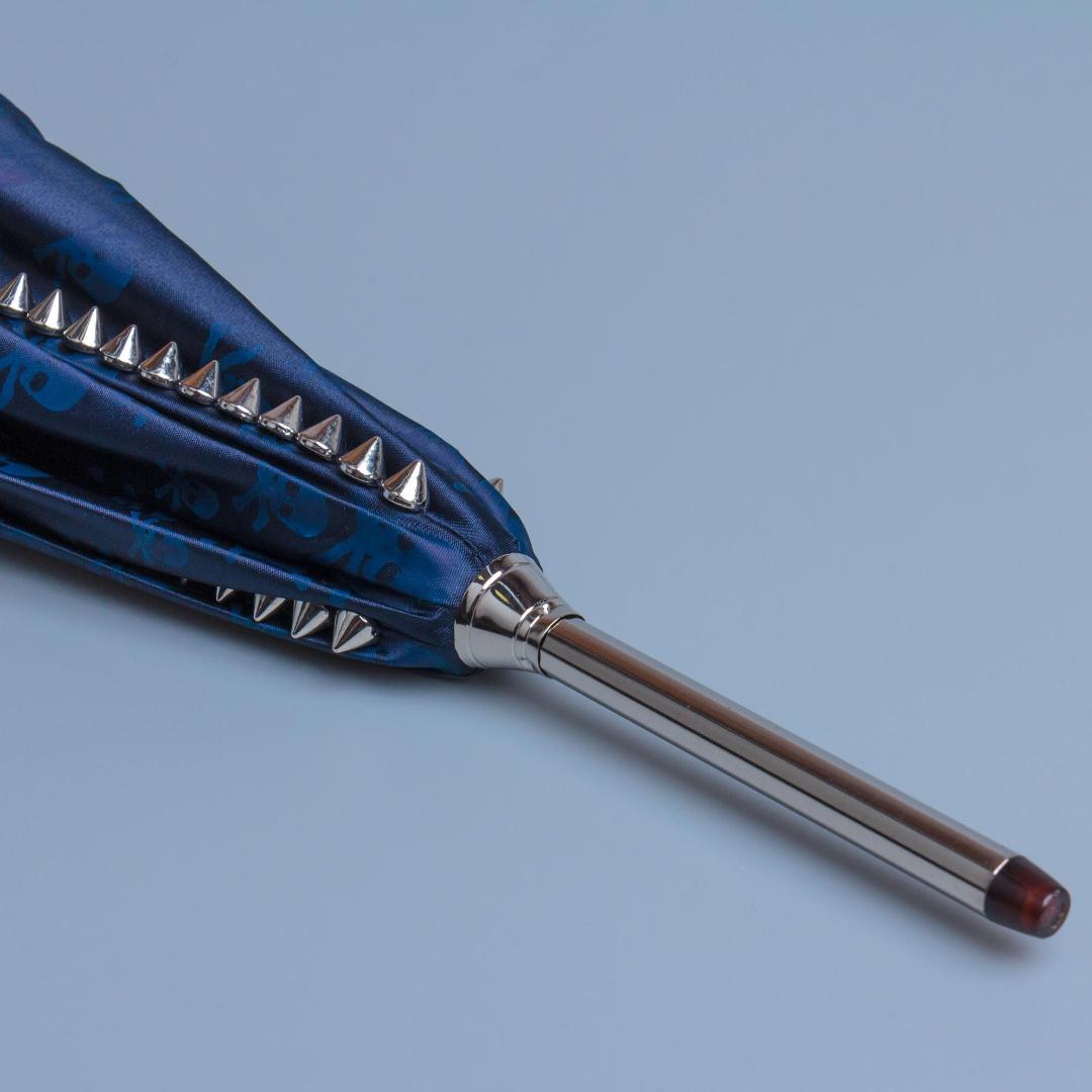 Men's Pasotti blue umbrella with spikes on the dome and skulls on the fabric