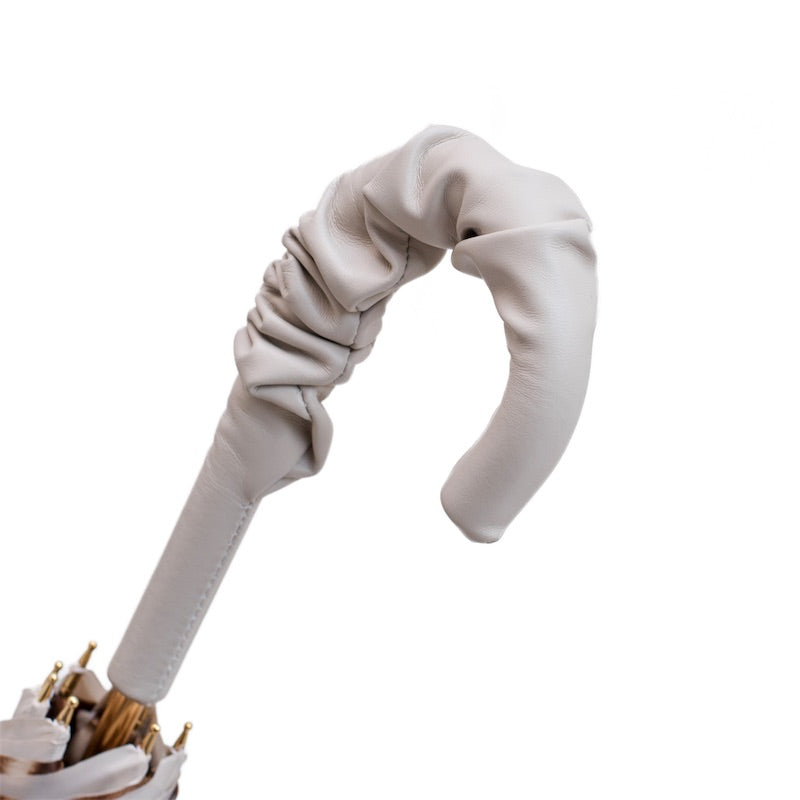 Leather-covered crook handle with gathered ruches along the curve