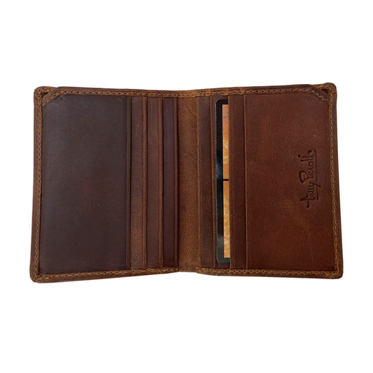 Tony Perotti Arno 1034N whisky — opened flat and empty: the rows of card slots on both halves and the embossed Tony Perotti signature on the right panel