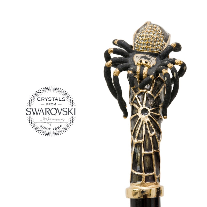 Spider handle from the front above a gold-tone collar and glossy black shaft