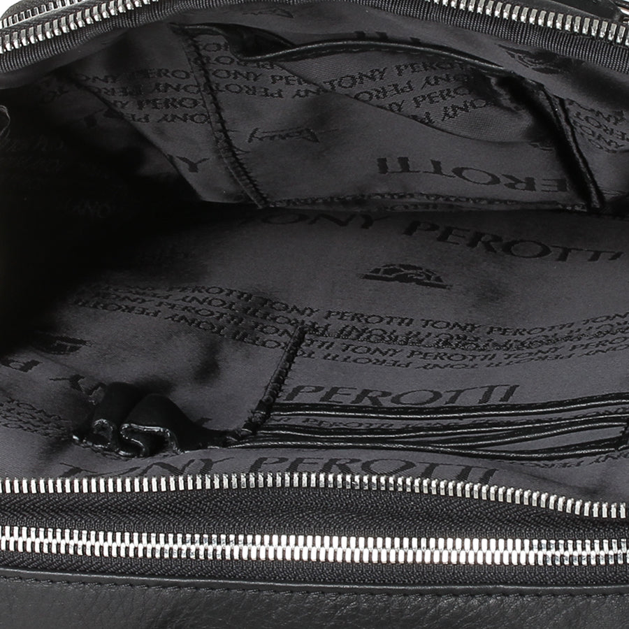 Close-up inside the New Contatto 9744-20 nero — lining printed with the Tony Perotti name and an inner pocket