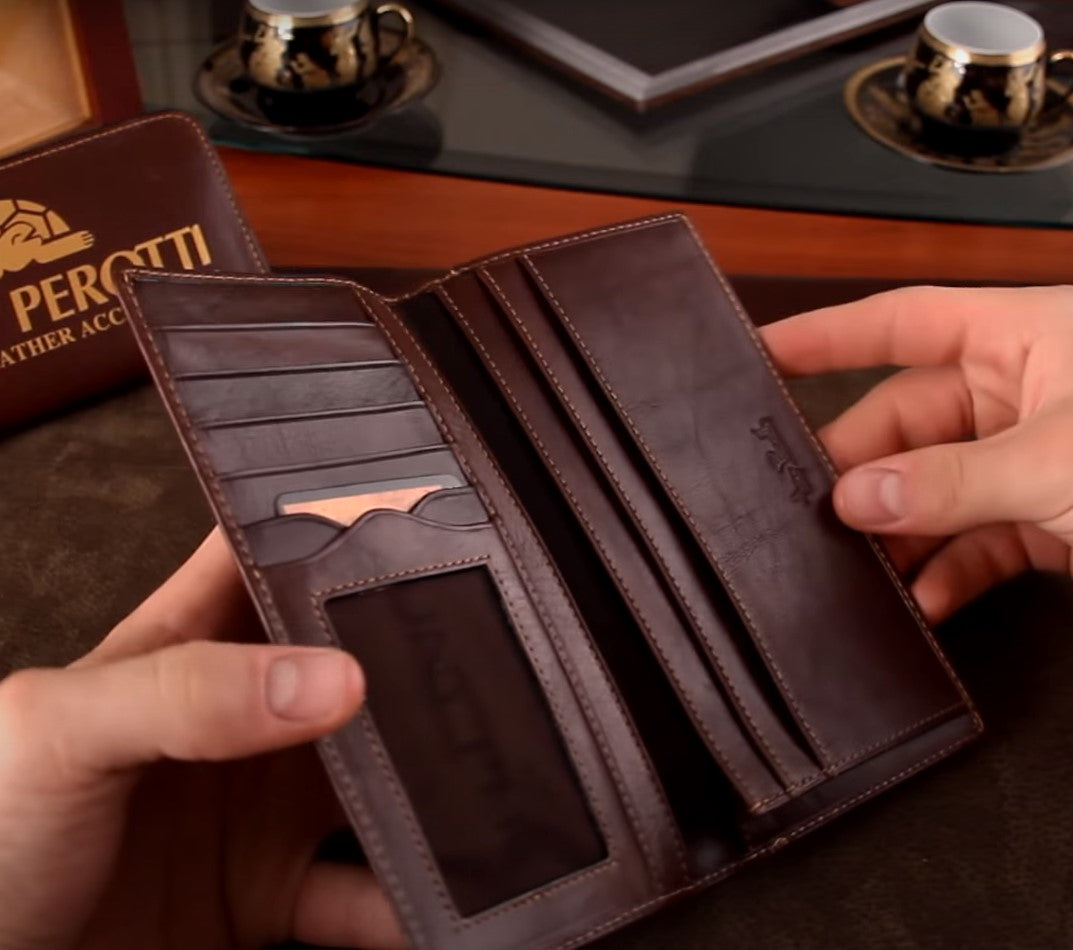 Brown Tony Perotti men's wallet in the hands of a man