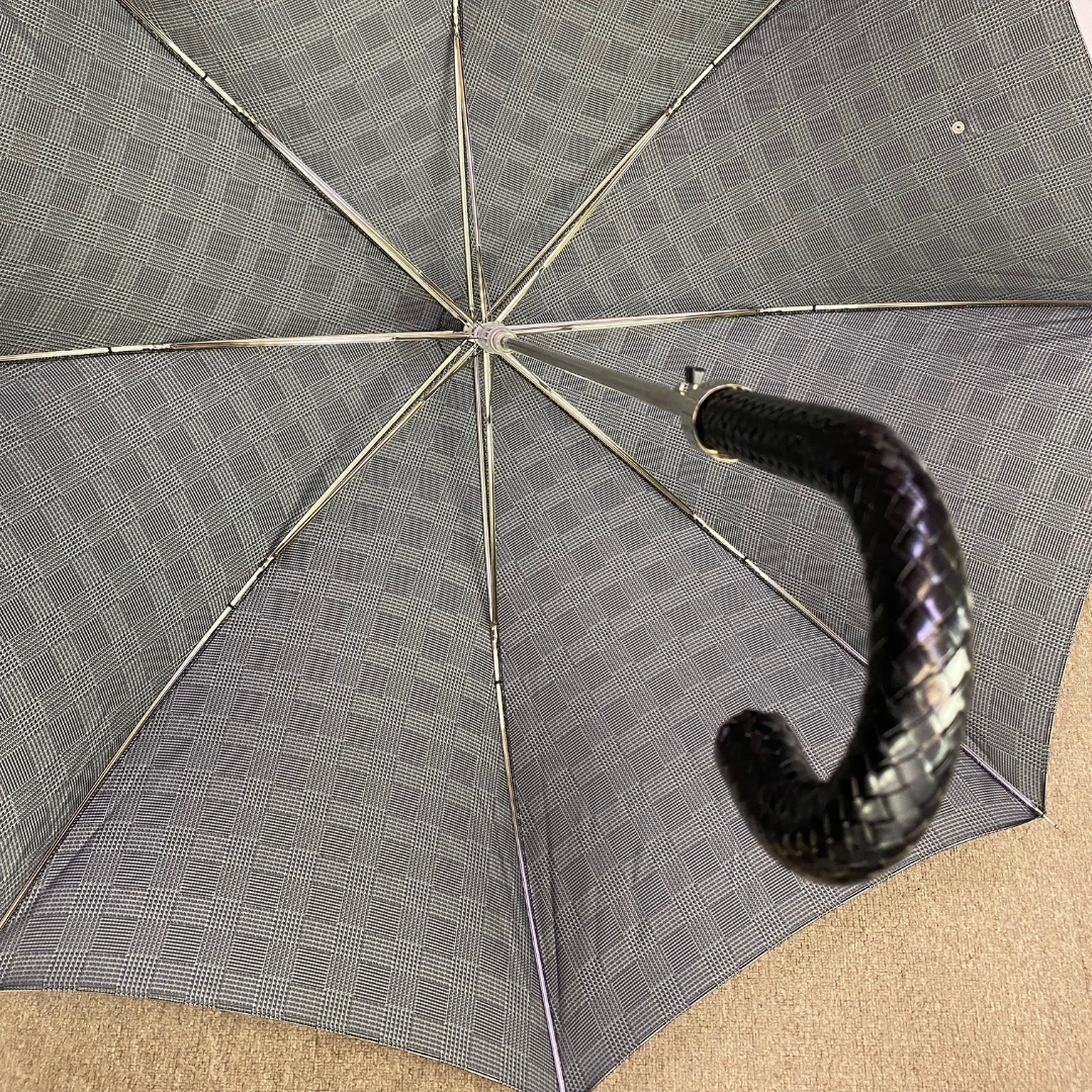 Pasotti umbrella with leather braided handle when open