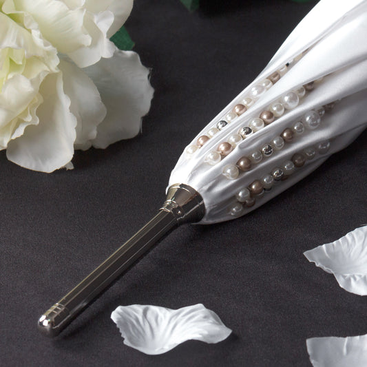 White wedding cane umbrella with hand-stitched pearls on the canopy and silver-tone crook handle