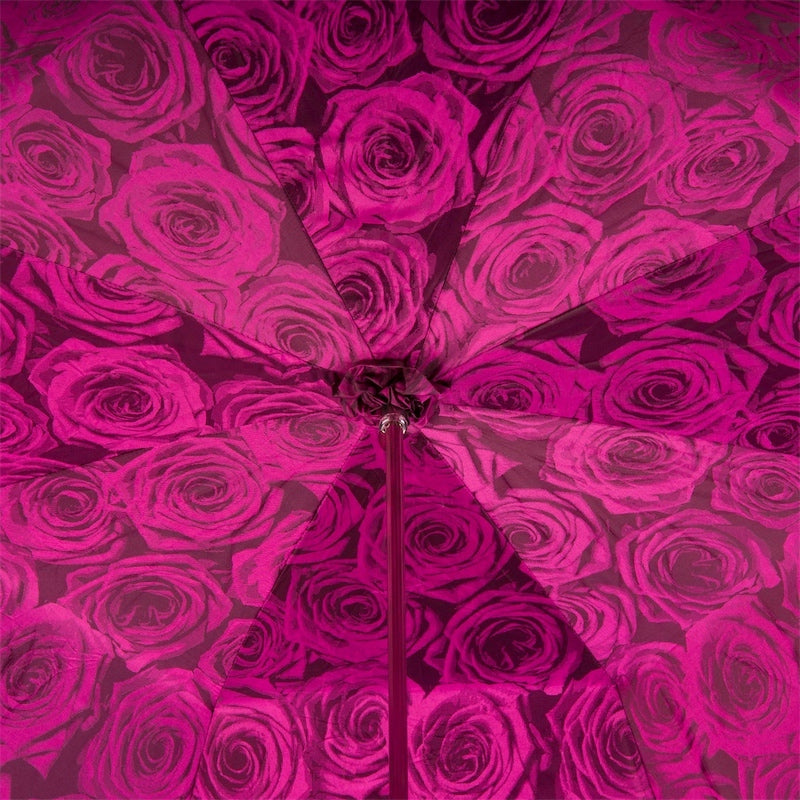Roses on the bottom layer of the dome of a woman's umbrella with a skull