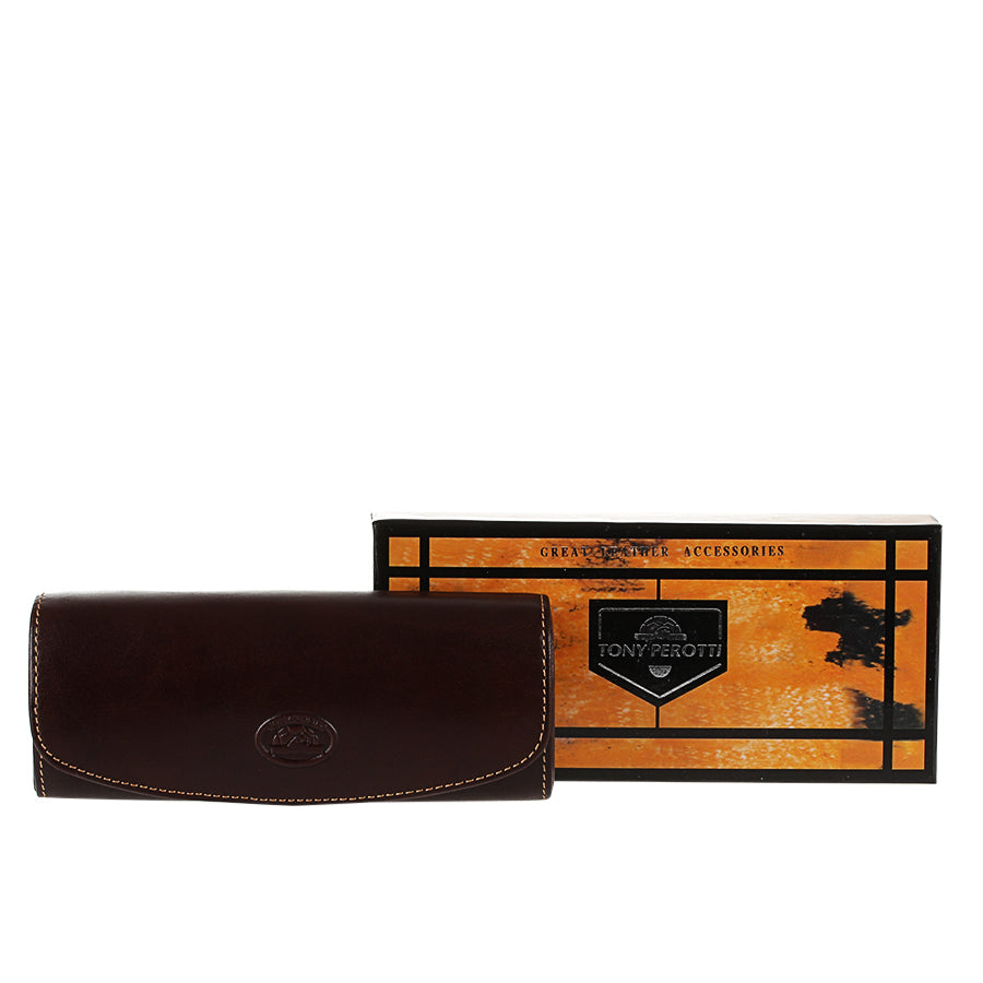 Dark brown leather glasses case Tony Perotti Italico 1290 moro next to its branded gift box
