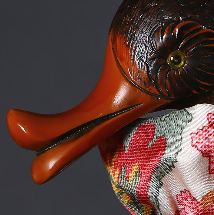 Close-up photo of a wooden handle in the shape of a duck umbrella by Pasotti