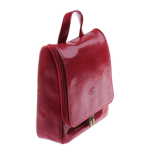 Tony Perotti Italico 8220 rosso toiletry bag — angled view showing the wrap-around zip and gold-tone hardware