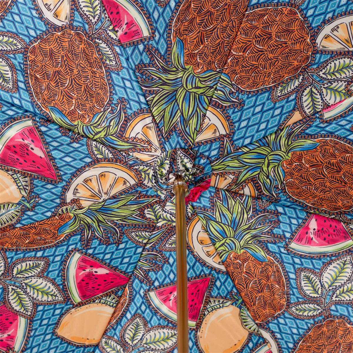 Inside of the canopy: pineapples, watermelon and citrus slices on a blue diamond pattern