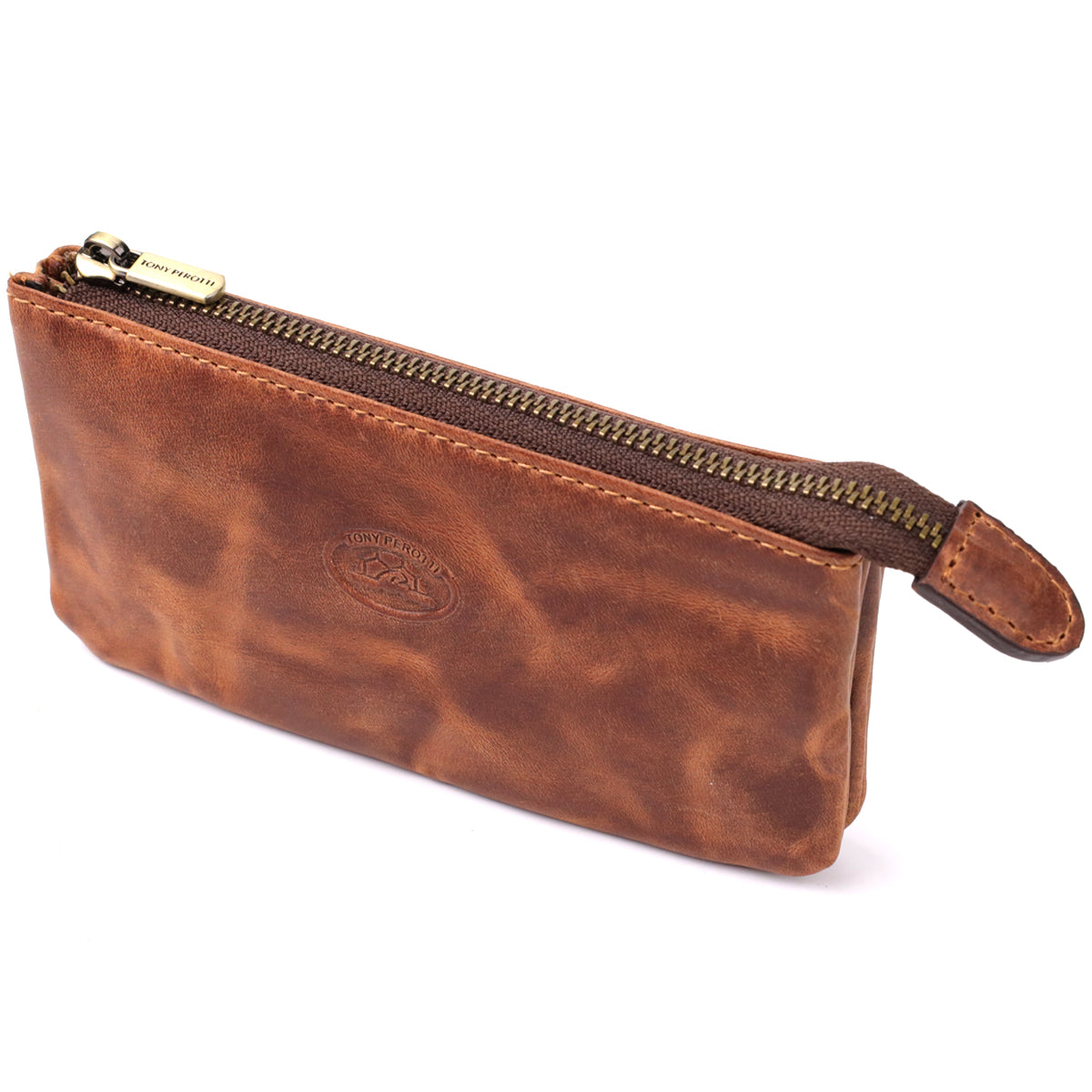 Tony Perotti Arno 3350 whisky tan leather key case at an angle — embossed oval emblem and a metal zip pull stamped Tony Perotti