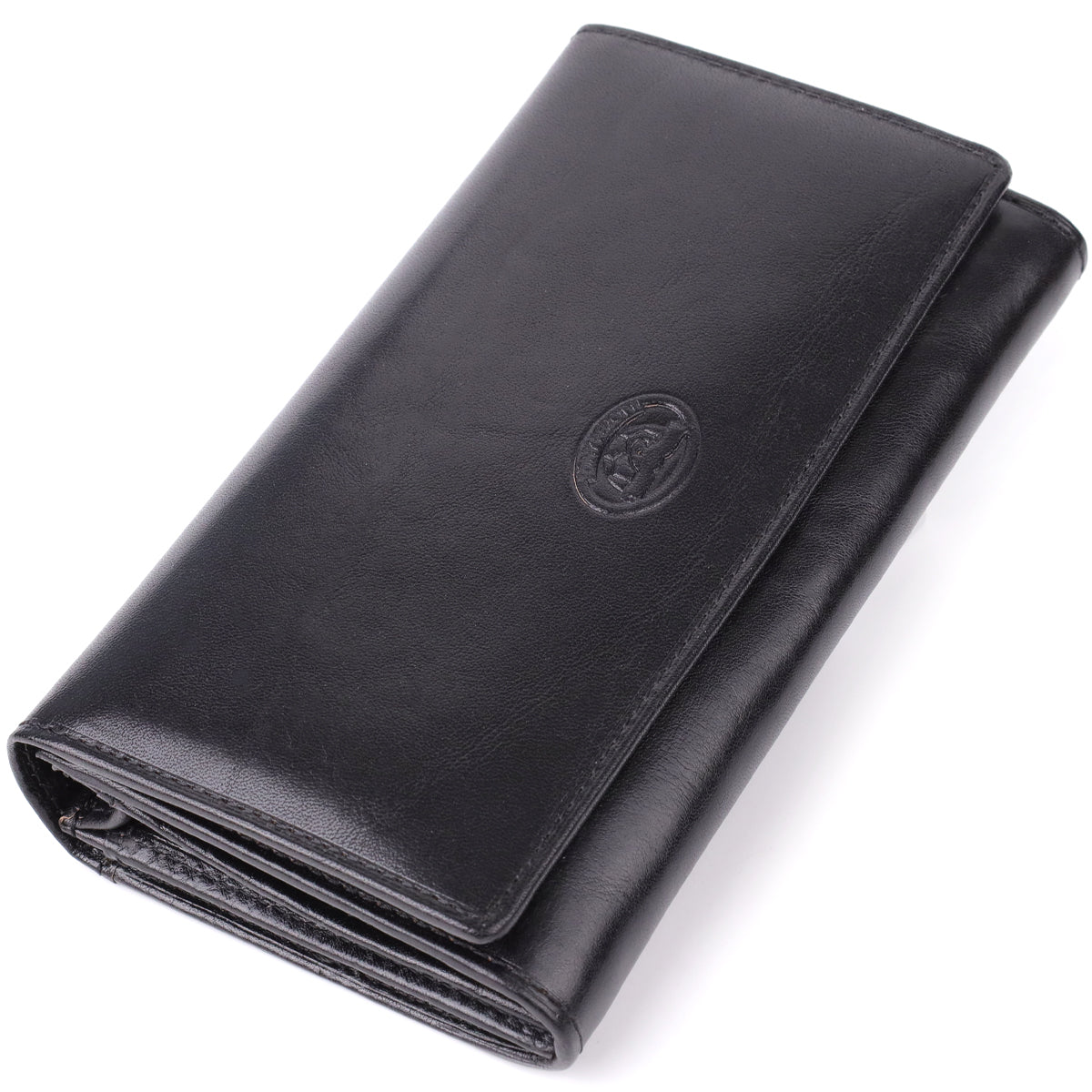 Tony Perotti Italico 1073 nero women's black leather long flap wallet, lying at an angle, closed — embossed oval Tony Perotti emblem