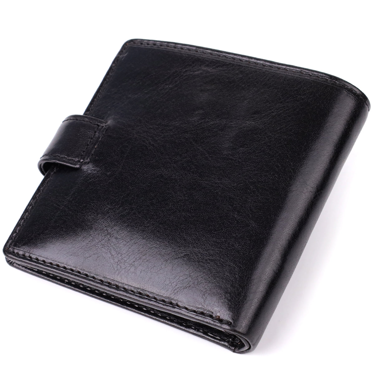 Tony Perotti Italico 1256 nero black leather compact wallet — closed back view at an angle, plain smooth leather with the snap strap visible at the edge
