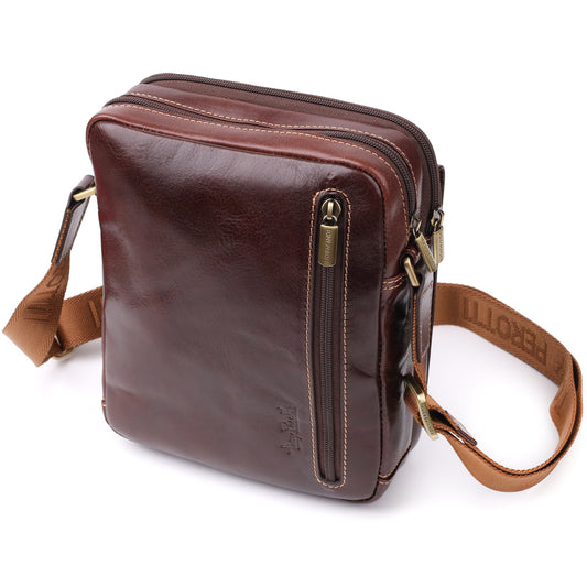 Side angled view of the Italico 9148-17 bag showing the front vertical zip pocket and the tan strap with woven TONY PEROTTI lettering