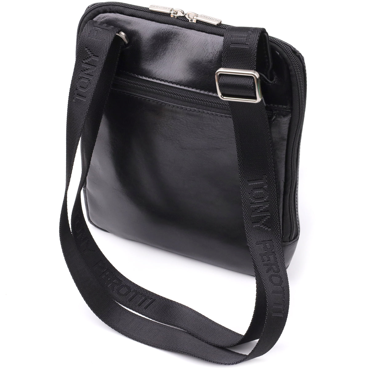 Side angled view of the Italico 9137-20 bag with the strap draped forward, showing the TONY PEROTTI lettering woven into the webbing and the sliding metal buckle