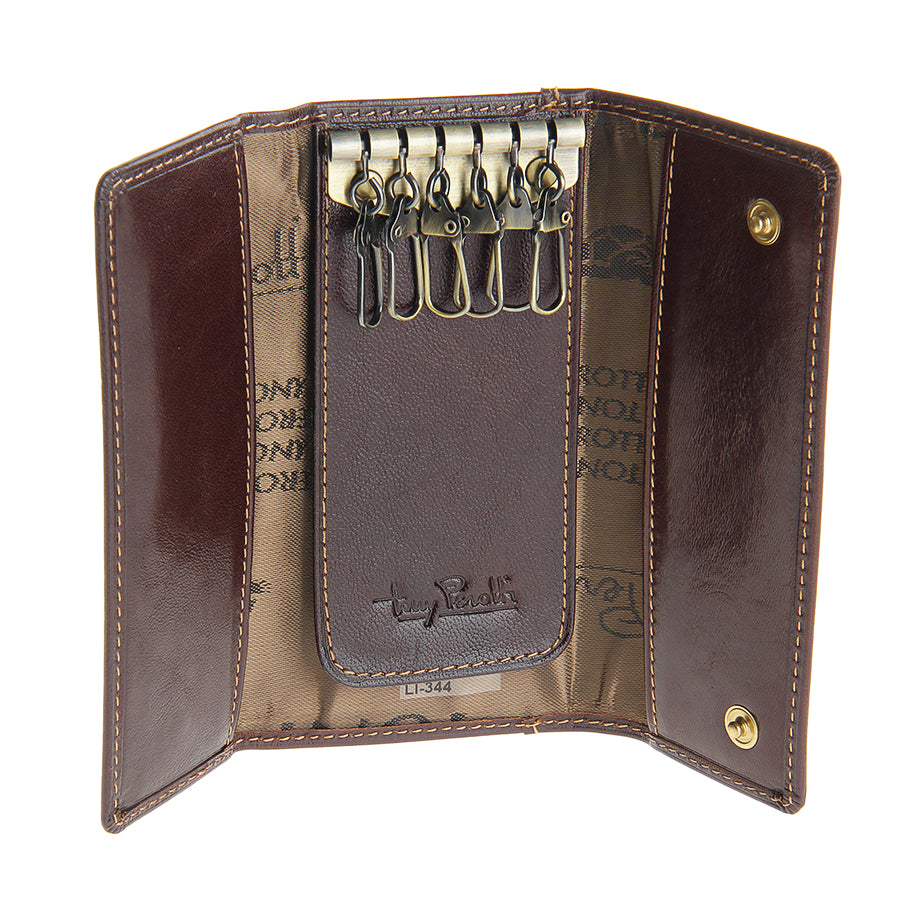 Dark brown leather key case open with six swivel key hooks and embossed Tony Perotti signature — Italico 344 moro