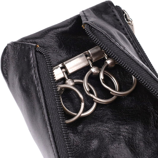 Macro close-up of the metal key holder bar with three rings inside the second zip compartment of the Italico 2686 nero key case