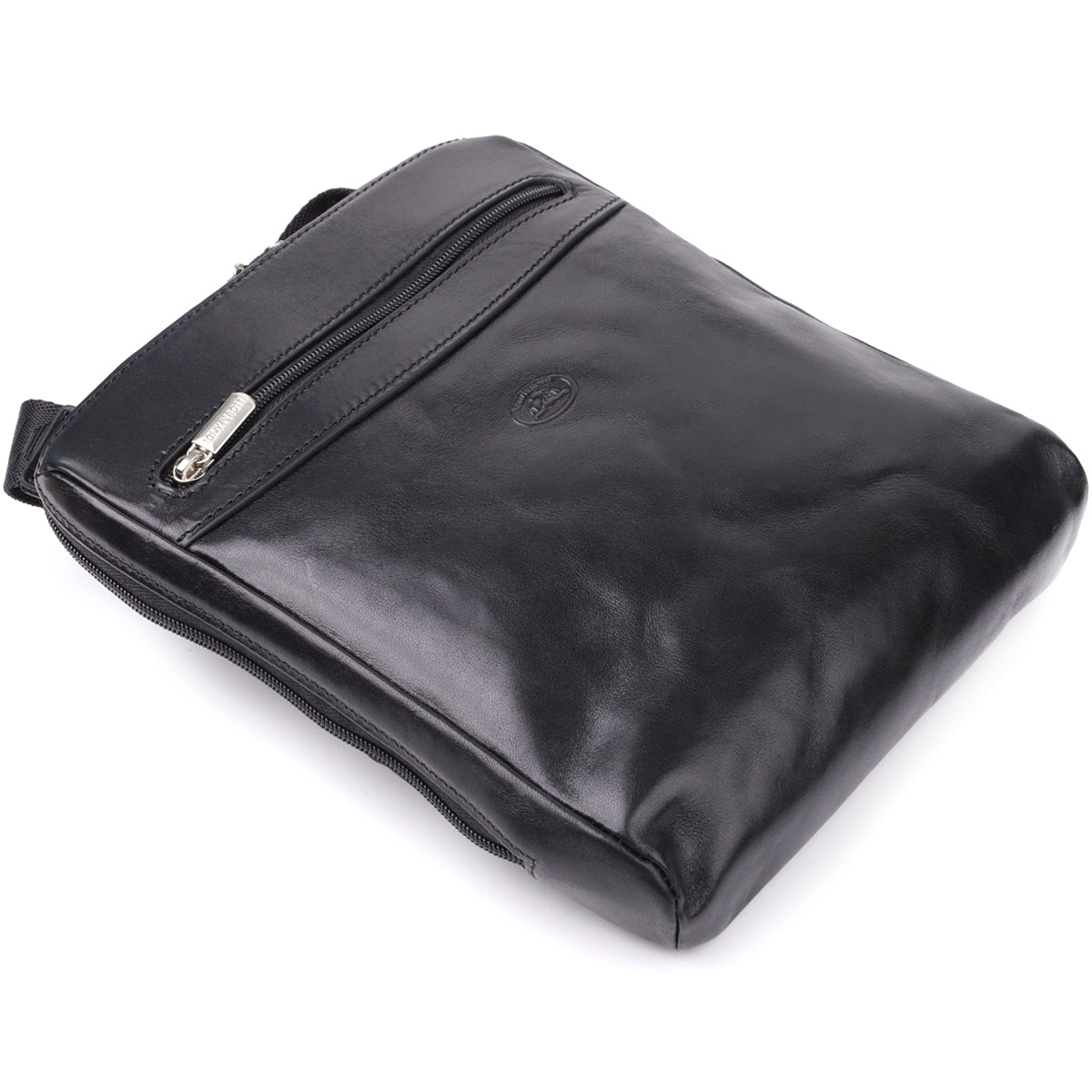 Front three-quarter view of the closed Italico 9137-20 bag resting on its base, showing the zip pocket and embossed oval emblem