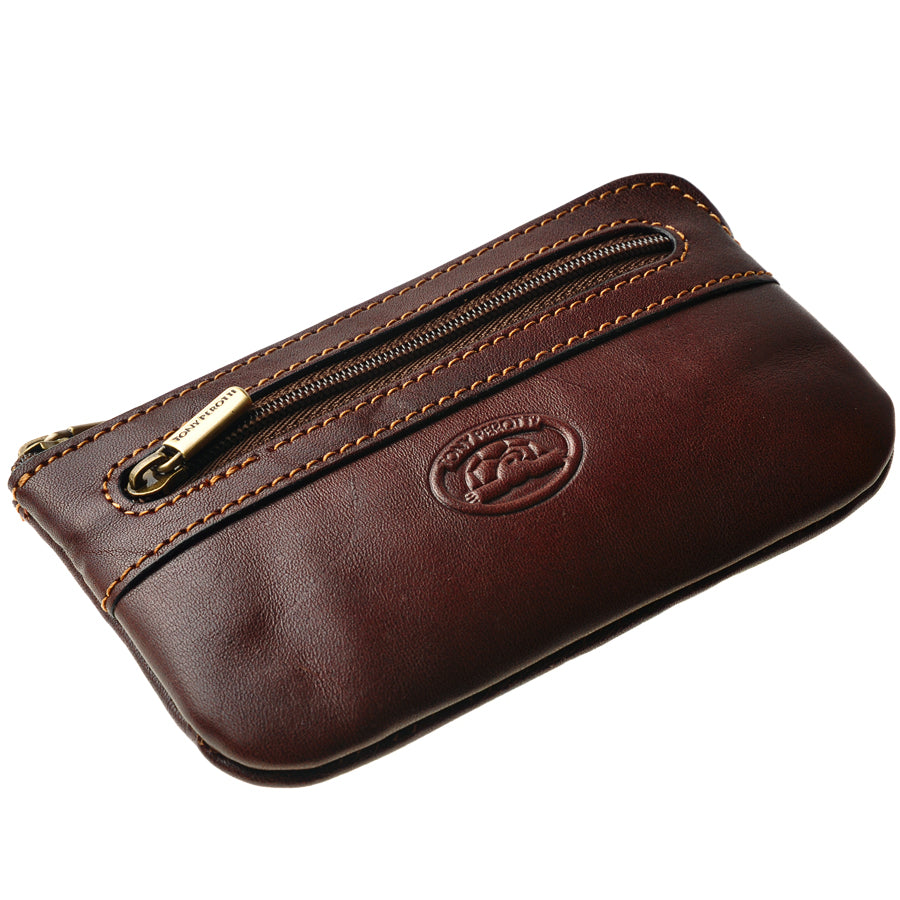 Dark brown leather key pouch, angled view with branded brass zip pulls — Tony Perotti Italico 359 moro