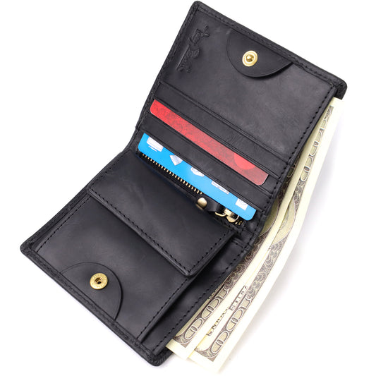 Tony Perotti Arno 1165 nero black leather bifold wallet — closed back view at an angle, plain leather