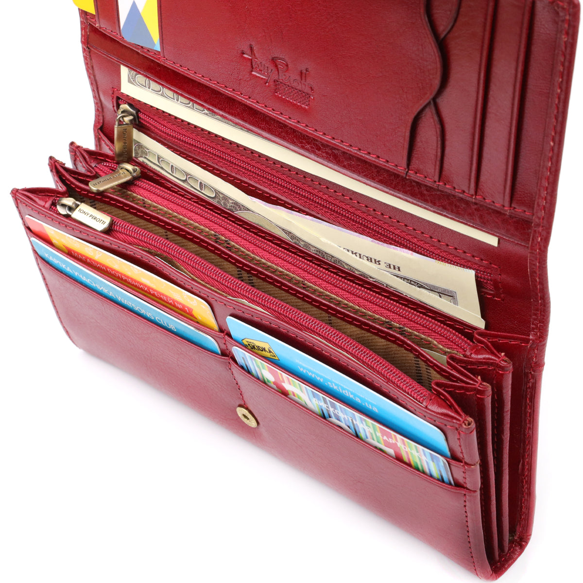 Tony Perotti Italico 1911 rosso red leather wallet open and filled — two layered zip pockets with branded pullers holding cash and cards