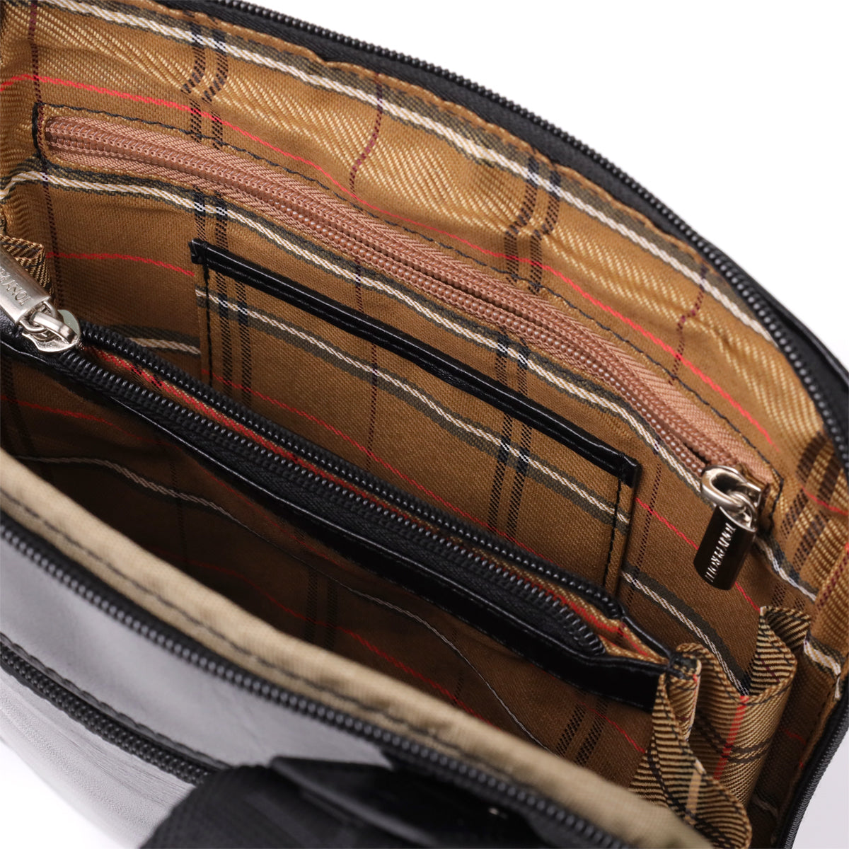 Close-up of the open Italico 9137-20 interior showing the zip compartments, checked lining and the round security hologram authenticity tag