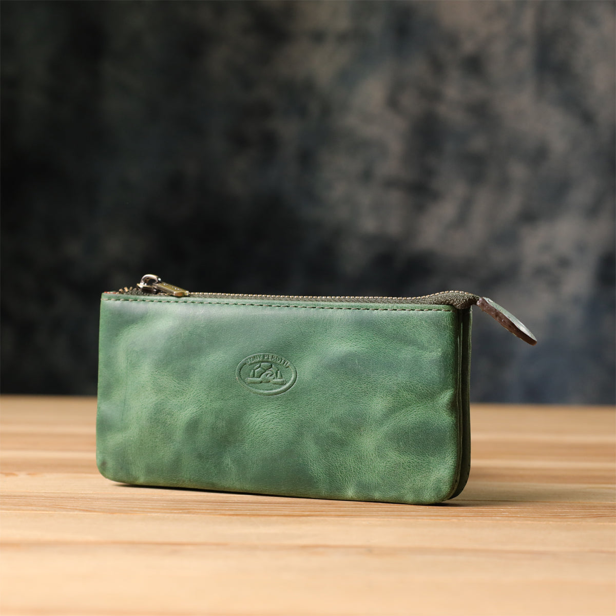 Tony Perotti Arno 3350 deep green key case with both key rings on brass chains hanging free