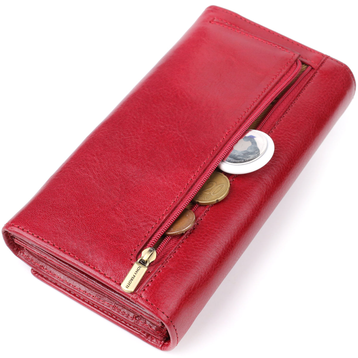 Tony Perotti Italico 1911 rosso red leather wallet with the exterior zip pocket unzipped, showing coins and a Bluetooth tracker tag inside