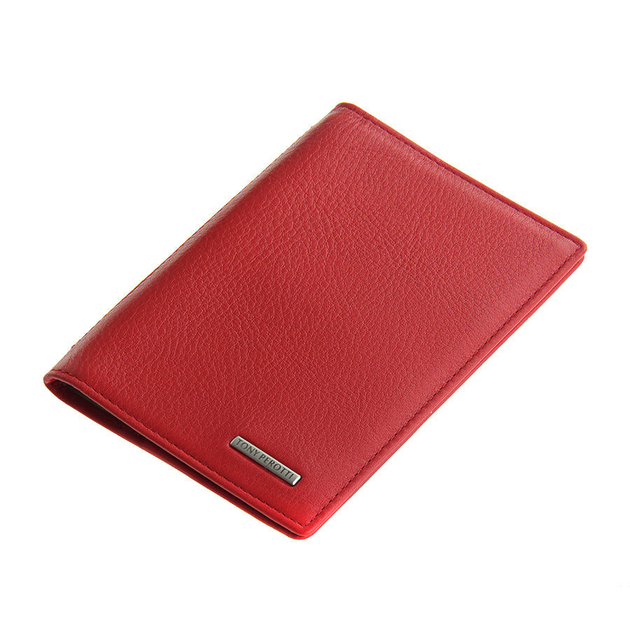 Angled view of the closed red Tony Perotti New Contatto 3550 rosso passport cover showing the logo plate