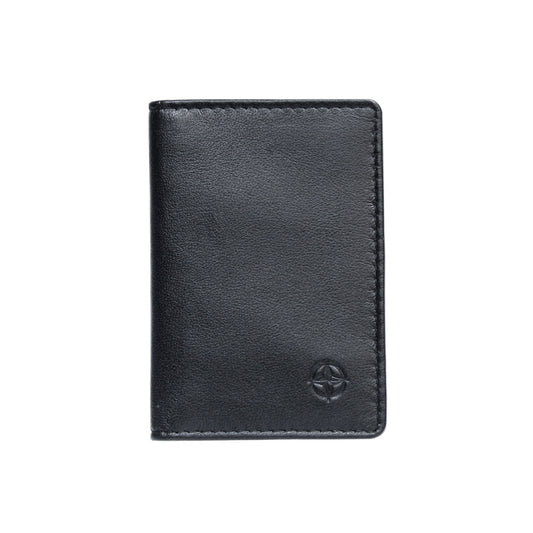 Tony Perotti Cortina 5004 nero — the black leather business card holder closed, with the embossed compass rose on the front
