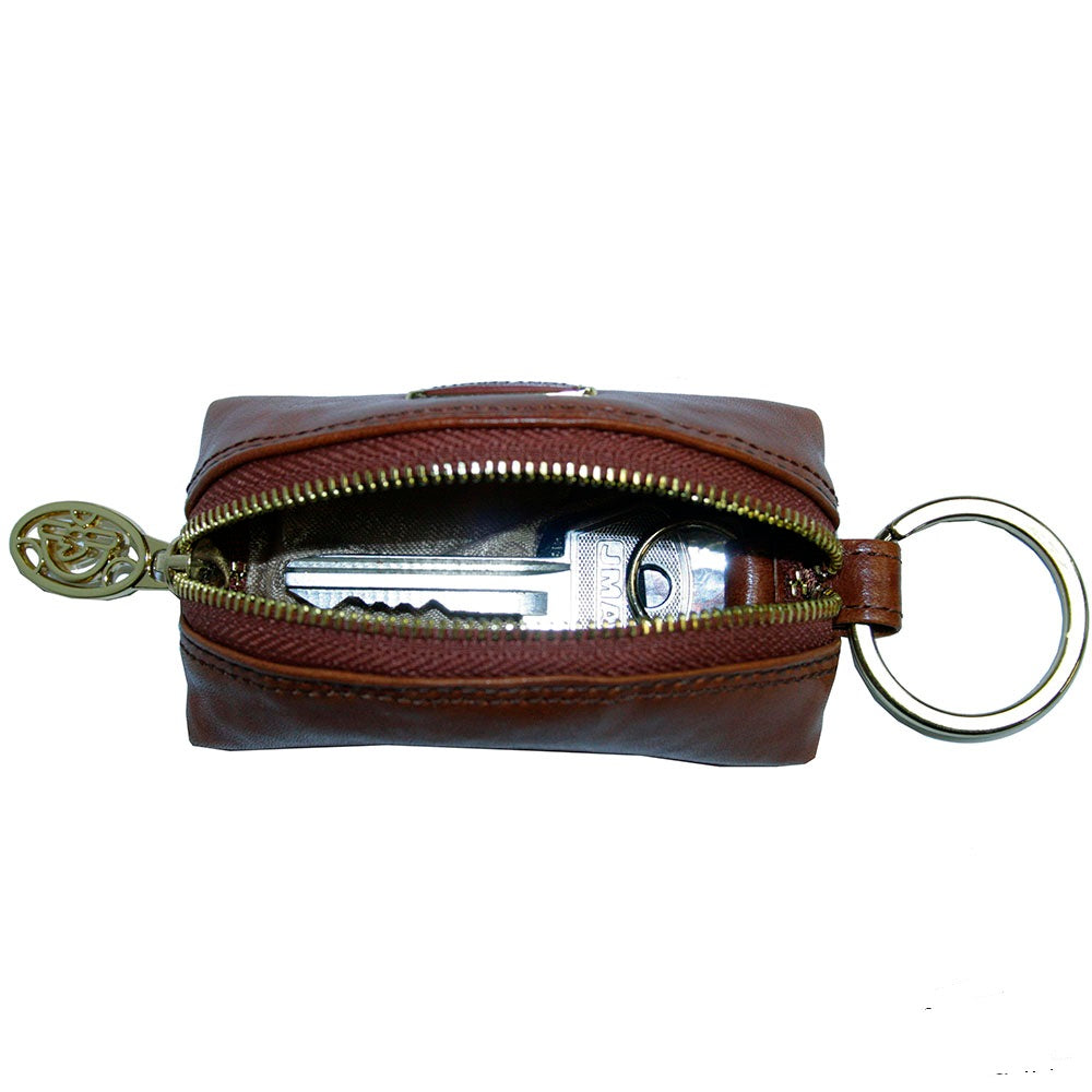 Tony Perotti Topkapi KR-186 ambra — the case unzipped with a car key and fob inside, showing the light grey lining and the split ring on its leather tab