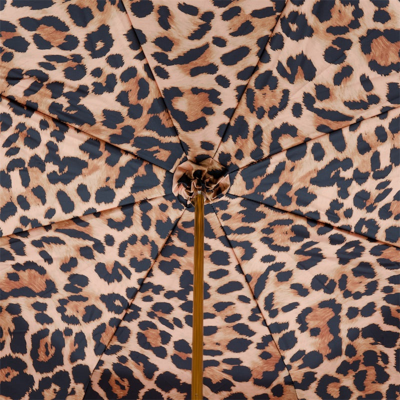 Inside of the canopy: leopard print in black and tan on a beige ground