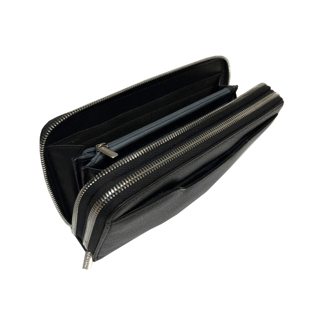Top view inside the black Tony Perotti 2886 clutch — the inner zip pocket that divides the second compartment into two sectors