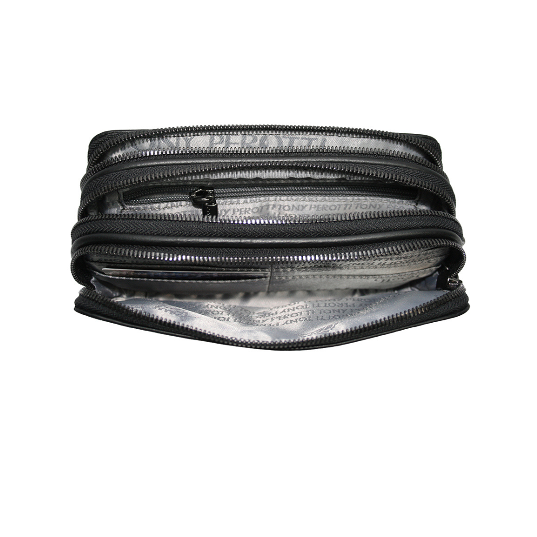Open interior of the black Tony Perotti clutch — three zip compartments with branded printed lining an inner zip pocket and leather card slots