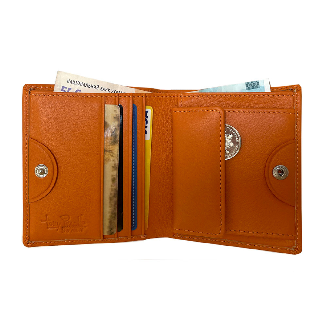 Open Tony Perotti orange leather compact wallet with cards and money on a white background