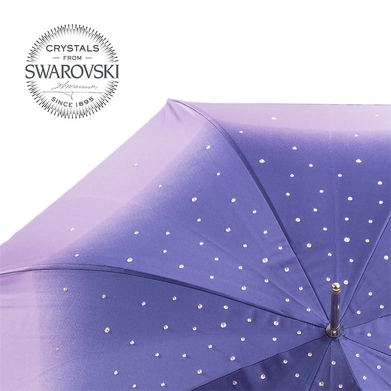 Clear Swarovski crystals stitched onto the lilac-to-violet canopy, close-up