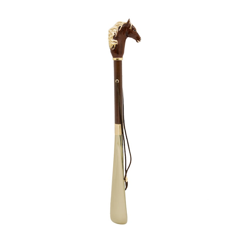 Horse shoehorn standing upright: brown wooden shaft, hanging cord and gold-tone blade