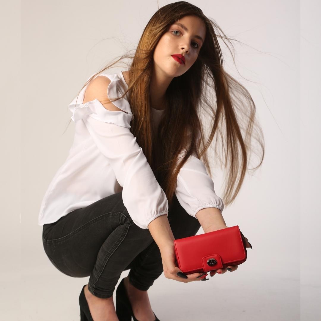 Fashion shot — model with the red Tony Perotti Swarovski wallet