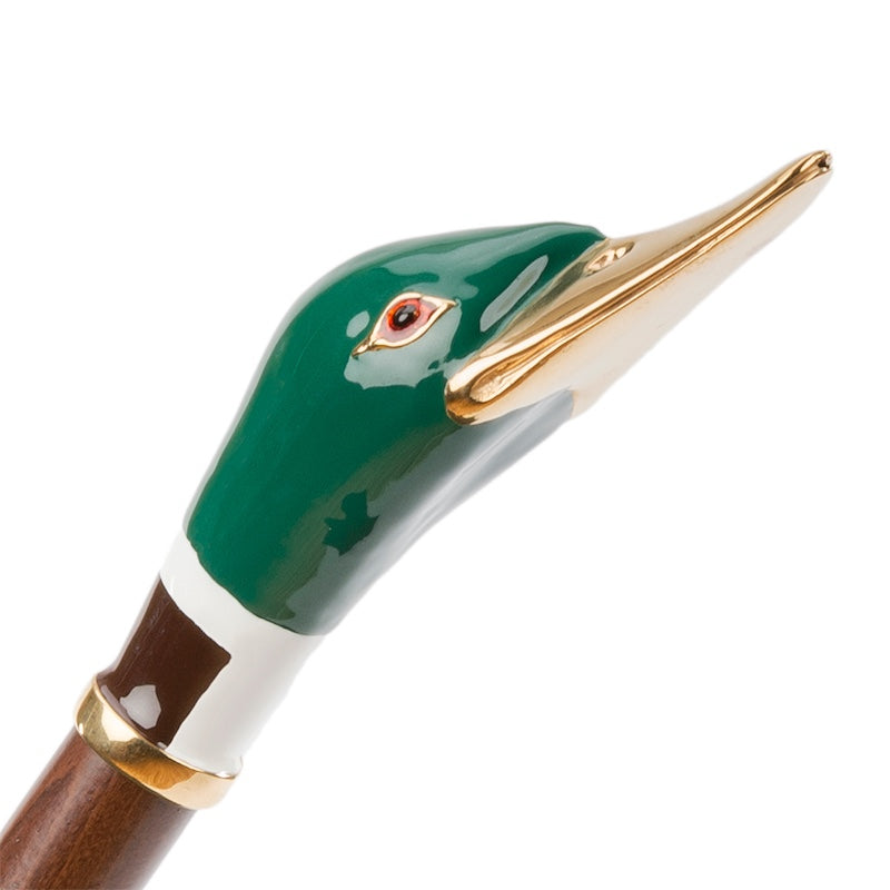 Green enameled mallard head with a gold-tone beak and white neck ring, close-up, handcrafted in Italy