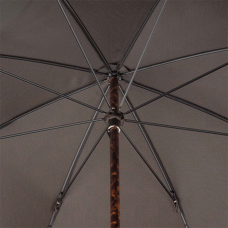 Underside of the brown canopy with eight ribs and mottled hickory shaft