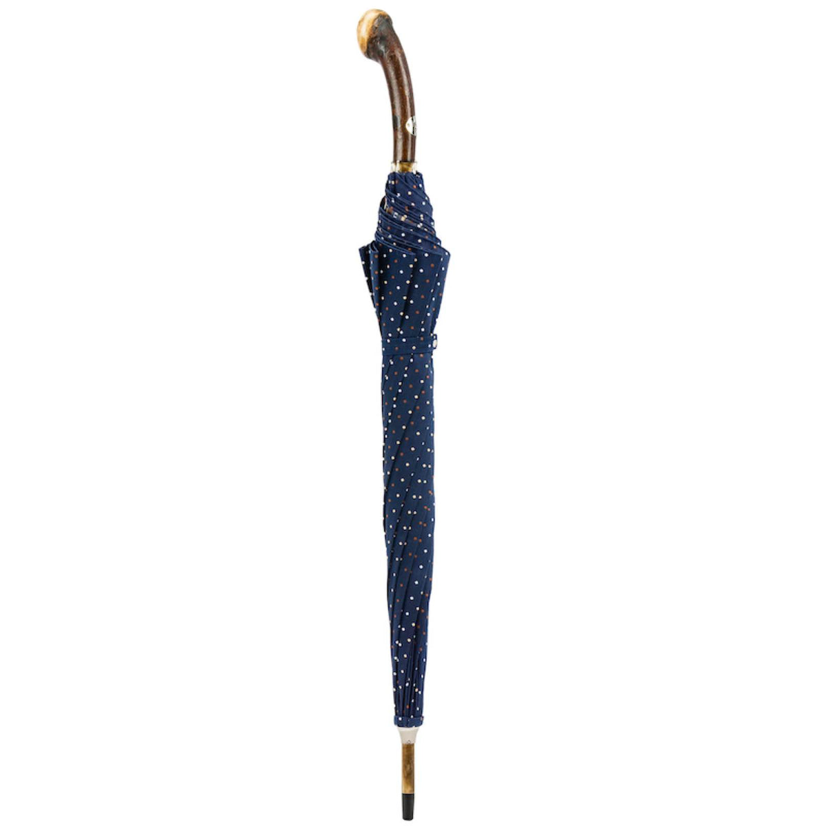 Closed navy fine-dot umbrella standing upright with curved chestnut handle