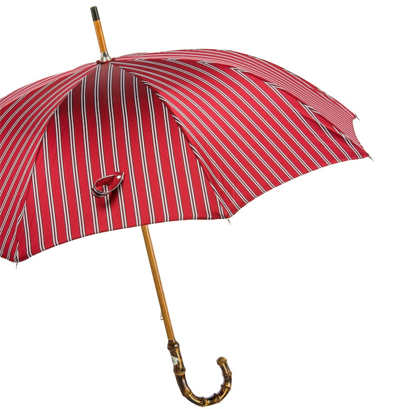 Open red striped umbrella from the side with bamboo crook handle
