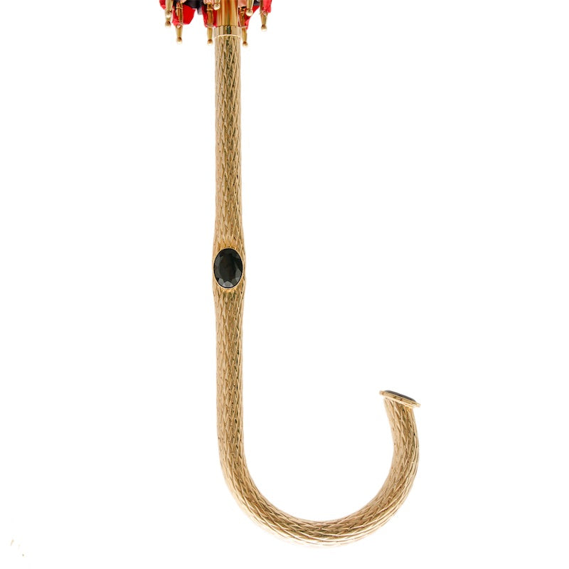 Full length of the engraved brass crook handle with a black oval rhinestone