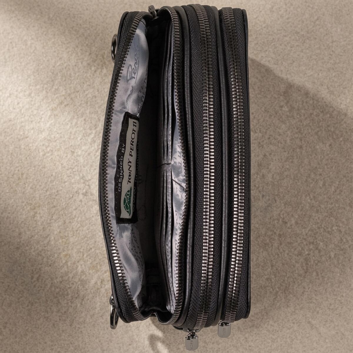 Inside the black Tony Perotti clutch — printed silk lining and the Designed by Tony Perotti label