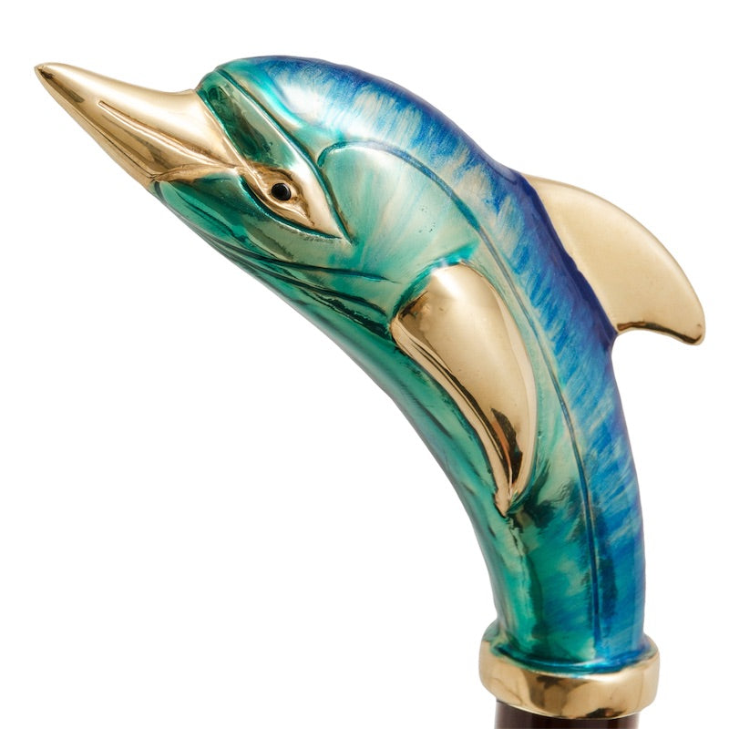 Dolphin handle above a gold-tone collar, macro close-up, handcrafted in Italy