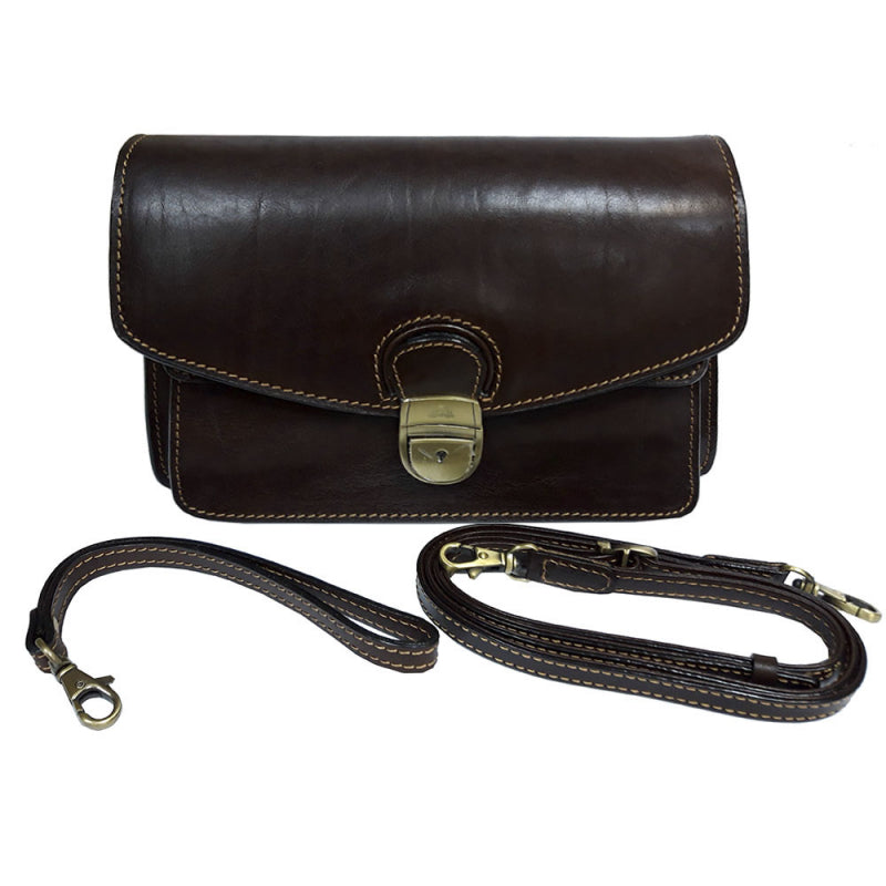 Brown Tony Perotti Italico 8264 leather clutch with both straps laid out — the leather wrist strap and the long adjustable shoulder strap