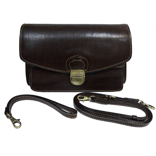 Brown Tony Perotti Italico 8264 leather clutch with both straps laid out — the leather wrist strap and the long adjustable shoulder strap