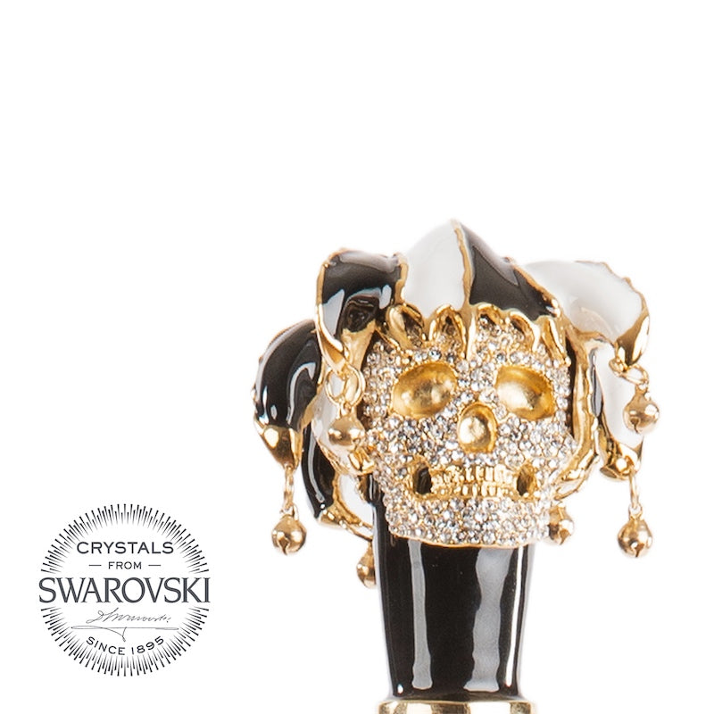 Jester skull from the front: black and white enameled cap with gold-tone bells, close-up, handcrafted in Italy