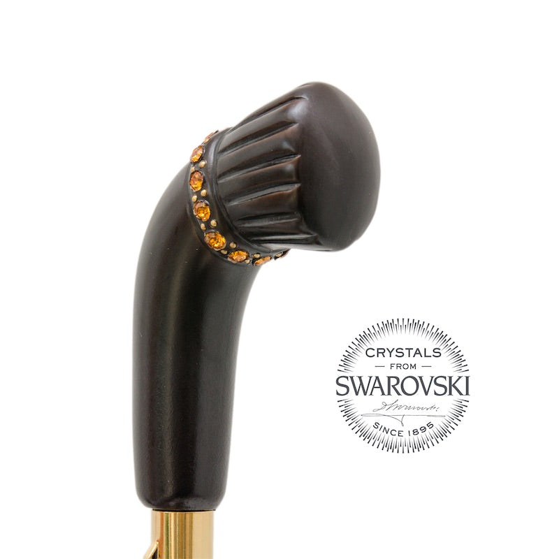 Dark wooden handle top with a band of amber-toned Swarovski crystals, close-up, handcrafted in Italy